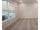 Bright bedroom featuring neutral walls and carpet, a window for natural light and modern details at 2325 Bay Minette Sta # 548, Apex, NC 27502