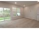 Bright, spacious bedroom with sliding door and view of landscaped backyard and wooded area at 2325 Bay Minette Sta # 548, Apex, NC 27502