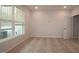 Neutral bedroom featuring modern details, a window for natural light, and a doorway to the closet at 2325 Bay Minette Sta # 548, Apex, NC 27502