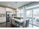 Bright dining area features a modern chandelier and sliding glass doors to an outdoor patio at 2325 Bay Minette Sta # 548, Apex, NC 27502