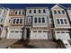 Charming townhouse with stone accents, a two-car garage, and a welcoming front entrance at 2325 Bay Minette Sta # 548, Apex, NC 27502
