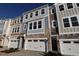 Charming townhome with an attached garage, stone accents, and meticulously maintained landscaping at 2325 Bay Minette Sta # 548, Apex, NC 27502