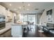 Modern kitchen open to the dining area featuring white cabinets and island seating at 2325 Bay Minette Sta # 548, Apex, NC 27502
