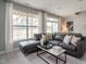 Cozy living room with large windows, comfortable seating, and stylish decor at 2325 Bay Minette Sta # 548, Apex, NC 27502