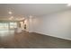 Open concept features vinyl floors and a kitchen with white cabinets and stainless appliances at 2325 Bay Minette Sta # 548, Apex, NC 27502