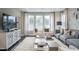 Bright living room featuring modern decor, plush seating, and large windows offering ample natural light at 2325 Bay Minette Sta # 548, Apex, NC 27502
