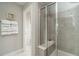 Modern walk-in shower with bench and neutral tile at 2325 Bay Minette Sta # 548, Apex, NC 27502