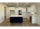 Modern kitchen featuring an island, white cabinets, and stainless steel appliances at 244 Combine Trl # Dm 108, Benson, NC 27504