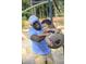 Father spins son on a tire swing at the neighborhood playground at 252 Beacon Dr, Pittsboro, NC 27312