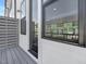 A cozy balcony featuring a privacy screen and outdoor access through a glass door at 324 Church St, Morrisville, NC 27560