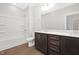A modern bathroom features double vanities and shower-tub combination at 324 Church St, Morrisville, NC 27560