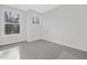 A well-lit bedroom showcasing a neutral carpet and modern windows at 324 Church St, Morrisville, NC 27560