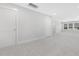 Open concept bonus room with neutral walls, carpet and baseboards with recessed lighting at 324 Church St, Morrisville, NC 27560
