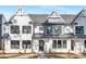 Charming new construction home featuring a modern design, black trim windows, and manicured landscaping at 324 Church St, Morrisville, NC 27560