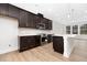 Stylish kitchen featuring stainless steel appliances, an island, and modern cabinets at 324 Church St, Morrisville, NC 27560