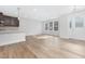 Bright open concept living space featuring wood floors, recessed lighting, and natural light at 324 Church St, Morrisville, NC 27560