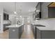 Spacious kitchen featuring a center island, stainless appliances, and lots of storage at 672 Georgia'S Landing Pkwy # 69, Raleigh, NC 27603