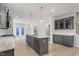 Modern kitchen with stainless steel appliances, island, and pendant lighting at 672 Georgia'S Landing Pkwy # 69, Raleigh, NC 27603