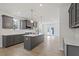 Well-designed kitchen with island, stainless appliances, and bright, open layout at 672 Georgia'S Landing Pkwy # 69, Raleigh, NC 27603