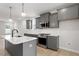 Modern kitchen with quartz countertops, stainless steel appliances, and stylish island at 672 Georgia'S Landing Pkwy # 69, Raleigh, NC 27603