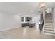 Bright open floor plan with hardwood floors and grey kitchen cabinets at 672 Georgia'S Landing Pkwy # 69, Raleigh, NC 27603