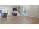 Inviting living space with wood floors, stylish fixtures and adjacent dining area at 672 Georgia'S Landing Pkwy # 69, Raleigh, NC 27603