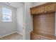 Bright mudroom with built-in storage and a window allowing natural light at 672 Georgia'S Landing Pkwy # 69, Raleigh, NC 27603