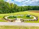 Community playground area featuring picnic tables and recreation equipment surrounded by manicured lawns at 672 Georgia'S Landing Pkwy # 69, Raleigh, NC 27603