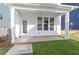 Covered back porch with a ceiling fan, offering a relaxing outdoor space for entertaining or enjoying the outdoors at 716 Georgias Landing Pkwy # 12, Raleigh, NC 27603