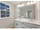 Bright bathroom with double sinks, white cabinets, quartz countertops, and modern lighting fixtures at 716 Georgias Landing Pkwy # 12, Raleigh, NC 27603