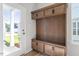 Cozy mudroom with custom built-in storage, bench seating, and easy access to the outdoors at 716 Georgias Landing Pkwy # 12, Raleigh, NC 27603