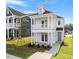 Inviting two-story home with a charming double porch and well-maintained landscaping at 716 Georgias Landing Pkwy # 12, Raleigh, NC 27603