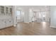 Open kitchen design with hardwood floors, white cabinets, and stainless appliances at 716 Georgias Landing Pkwy # 12, Raleigh, NC 27603