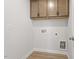 Laundry room with upper cabinets and vinyl floor; ready for washer and dryer hookup at 716 Georgias Landing Pkwy # 12, Raleigh, NC 27603