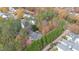 Aerial view of house and private wooded lot, showcasing a neighborhood setting at 1620 Dunn Rd, Raleigh, NC 27614