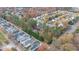 Aerial view showcasing the home's private setting amongst mature trees at 1620 Dunn Rd, Raleigh, NC 27614