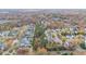 Wide aerial view of neighborhood with autumn leaves and a tree-lined street at 1620 Dunn Rd, Raleigh, NC 27614