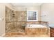 Bathroom with a large walk-in shower and garden tub at 1620 Dunn Rd, Raleigh, NC 27614