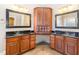 Double vanity bathroom with granite countertops and wood cabinets at 1620 Dunn Rd, Raleigh, NC 27614