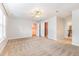Spacious bedroom with carpeting, ceiling fan, and access to bathroom at 1620 Dunn Rd, Raleigh, NC 27614