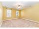 Spacious bedroom with neutral walls and carpet flooring at 1620 Dunn Rd, Raleigh, NC 27614