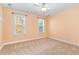Bright bedroom with neutral walls, carpeting, and two windows at 1620 Dunn Rd, Raleigh, NC 27614