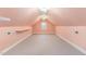 Spacious bonus room with light peach walls and carpet at 1620 Dunn Rd, Raleigh, NC 27614
