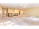 Large bonus room featuring hardwood floors and a staircase at 1620 Dunn Rd, Raleigh, NC 27614