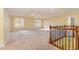 Spacious bonus room with neutral carpet and natural light at 1620 Dunn Rd, Raleigh, NC 27614