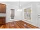 Kitchen breakfast nook with hardwood floors and large windows at 1620 Dunn Rd, Raleigh, NC 27614