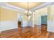Bright dining room with hardwood floors and elegant chandelier at 1620 Dunn Rd, Raleigh, NC 27614