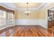 Elegant dining room with hardwood floors and chandelier at 1620 Dunn Rd, Raleigh, NC 27614