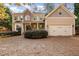 Two-story house with stone accents and driveway at 1620 Dunn Rd, Raleigh, NC 27614