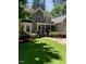 Two-story home with a large, well-maintained lawn and mature trees at 1620 Dunn Rd, Raleigh, NC 27614